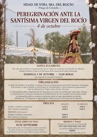 Cartel con imagen de la Virgen del Rocío bajo un cielo claro y luces decorativas, anunciando la peregrinación del 4 de octubre en Priego de Córdoba